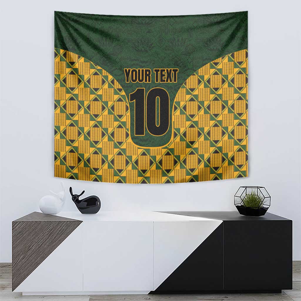 Geometric kente tapestry wall hanging in green and yellow with gold '10' and 'YOUR TEXT'.