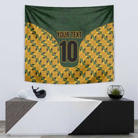 Geometric kente tapestry wall hanging in green and yellow with gold '10' and 'YOUR TEXT'.