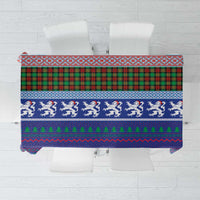 Blue plaid Christmas tablecloth with tartan bands, lion motif, and festive border