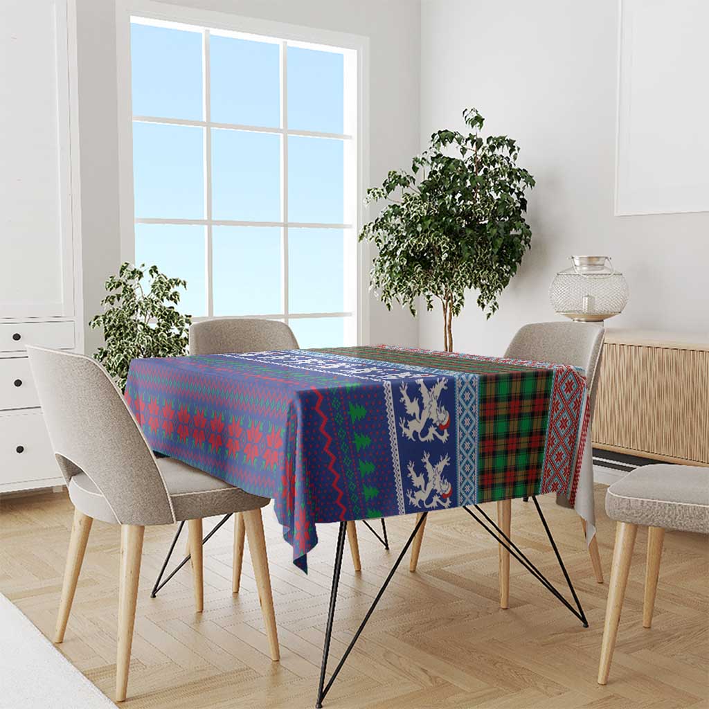 Blue lion and tartan Christmas tablecloth draped over dining table with chairs