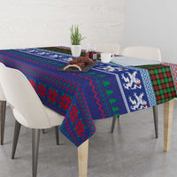 Blue Christmas tablecloth with plaid, geometric patterns, and lion print detail