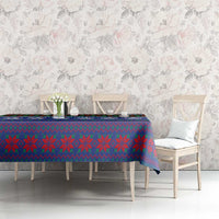 Blue tartan and geometric Christmas tablecloth with lion accents on dining table