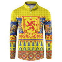 Yellow button henley sweatshirt with red crest and blue festive patterns
