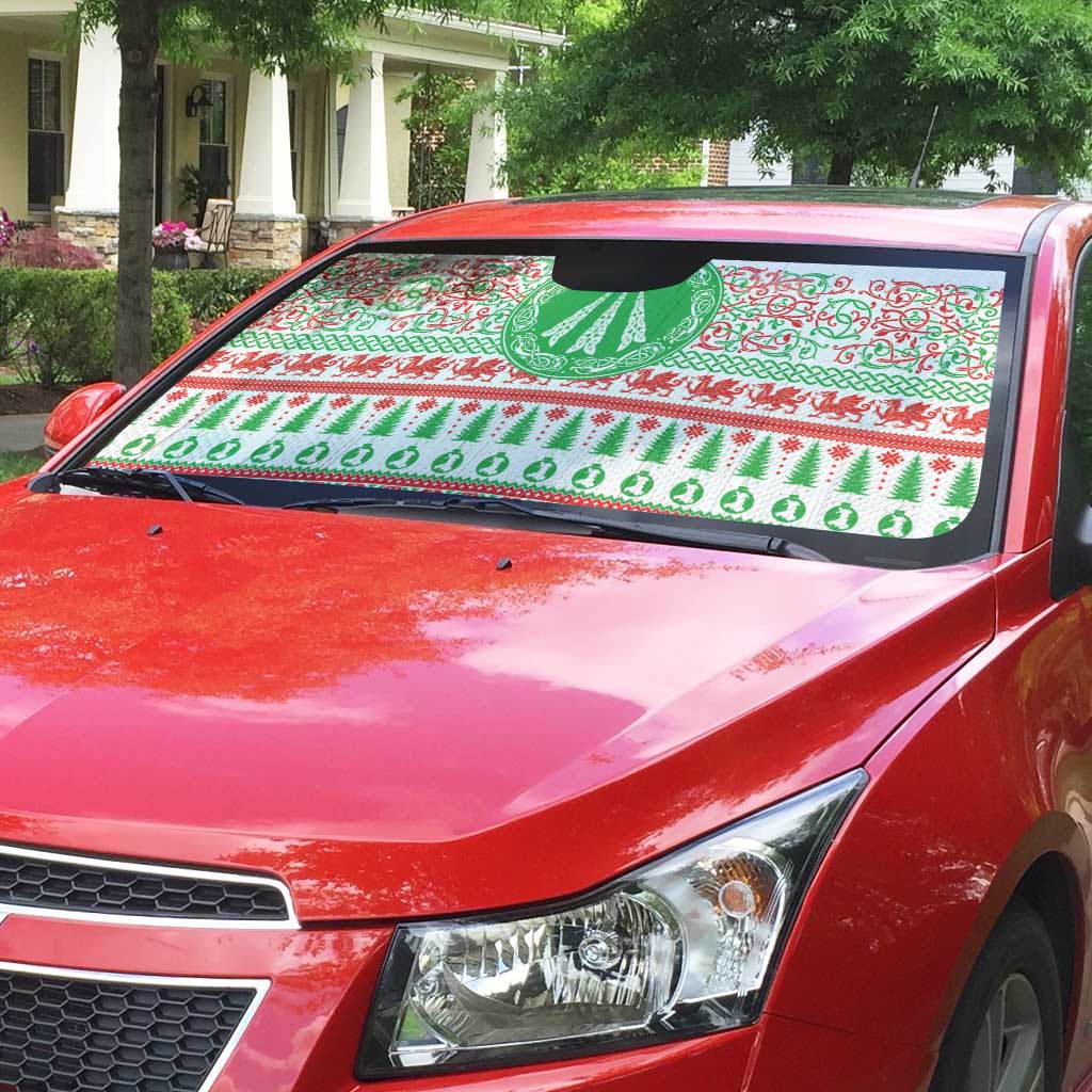 Auto sun shade on red car windshield, green and red festive Celtic design
