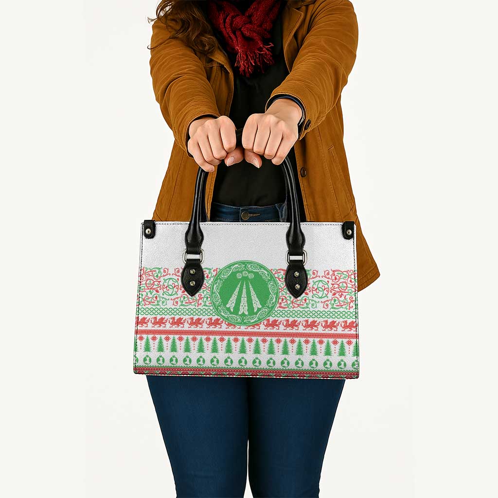 White tote bag with black top handles and festive red-green patterned front
