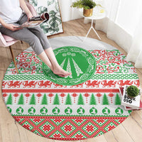 Christmas round carpet design with green tree emblem, red border, green Celtic knots and icons