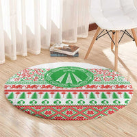 Christmas round rug with green center tree, red and green festive stripes, and Celtic-style knots