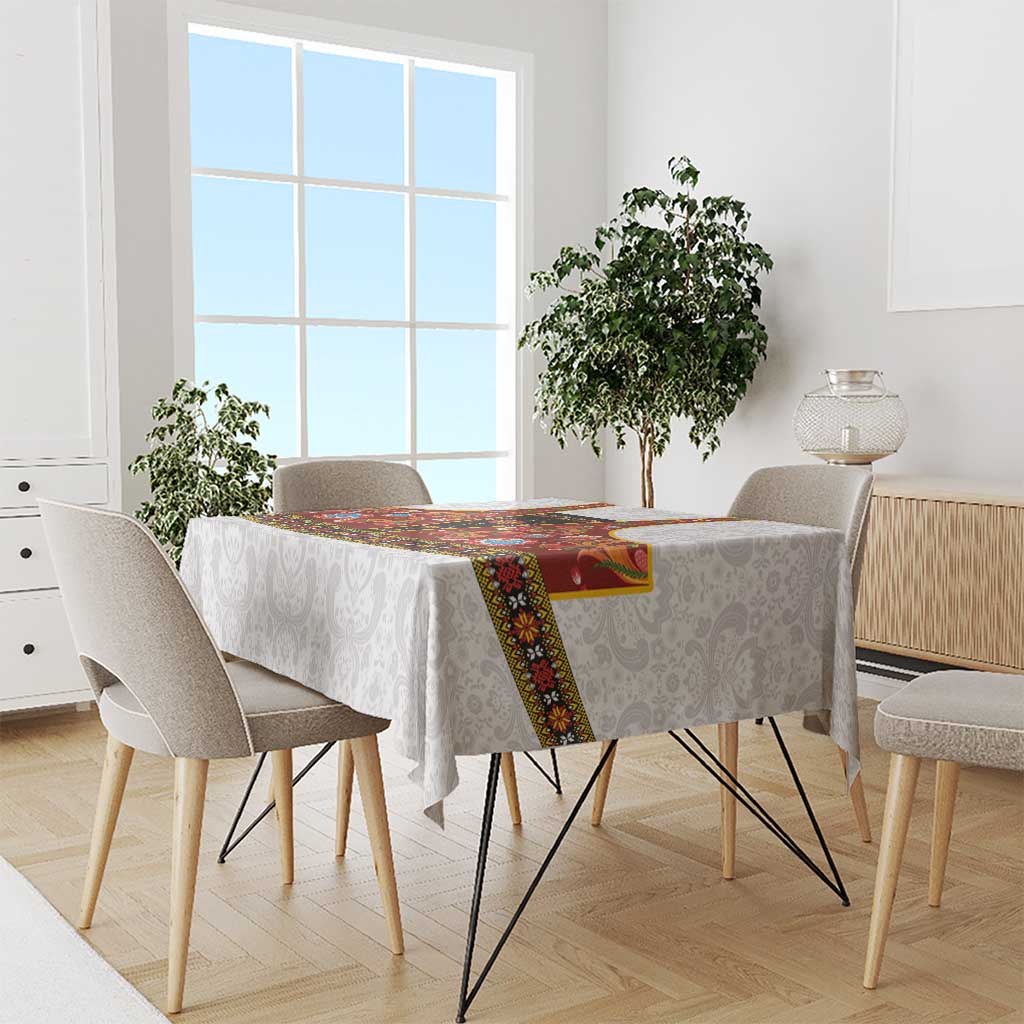 Gray damask tablecloth with red rosemaling runner and multicolor folk floral border