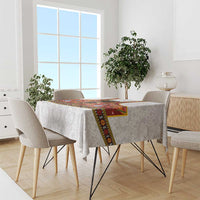 Gray damask tablecloth with red rosemaling runner and multicolor folk floral border