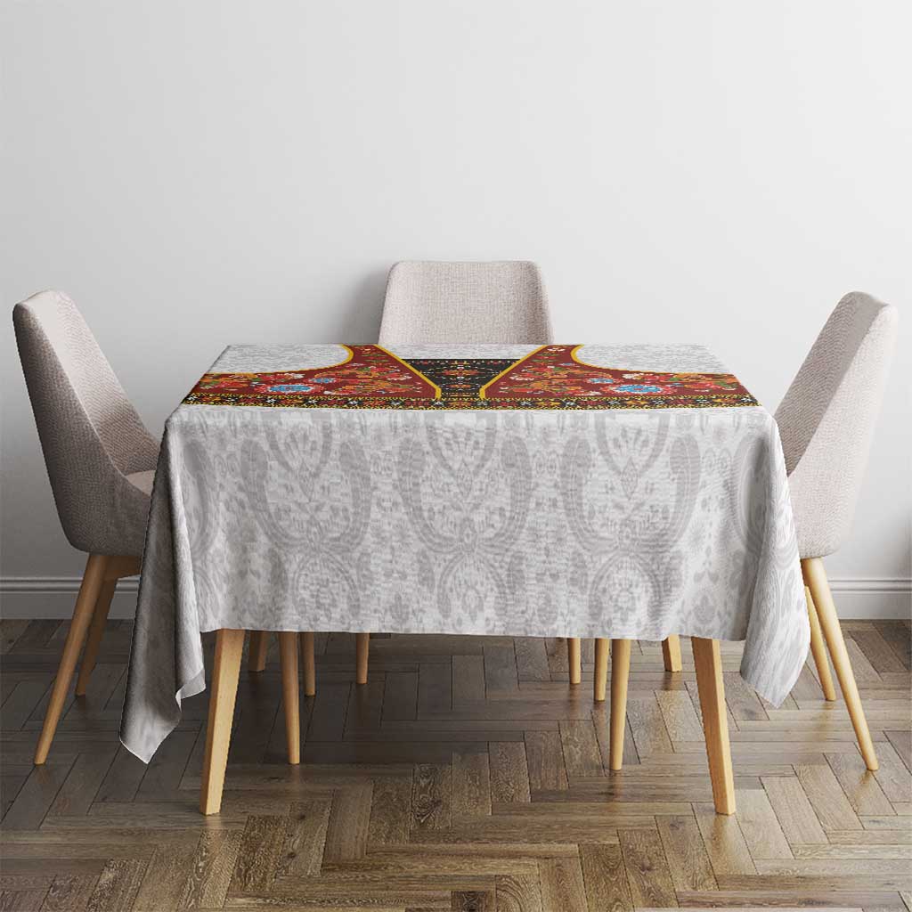 Square gray damask tablecloth with red rosemaling centerpiece and folk floral trim