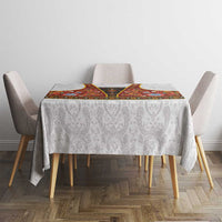Square gray damask tablecloth with red rosemaling centerpiece and folk floral trim