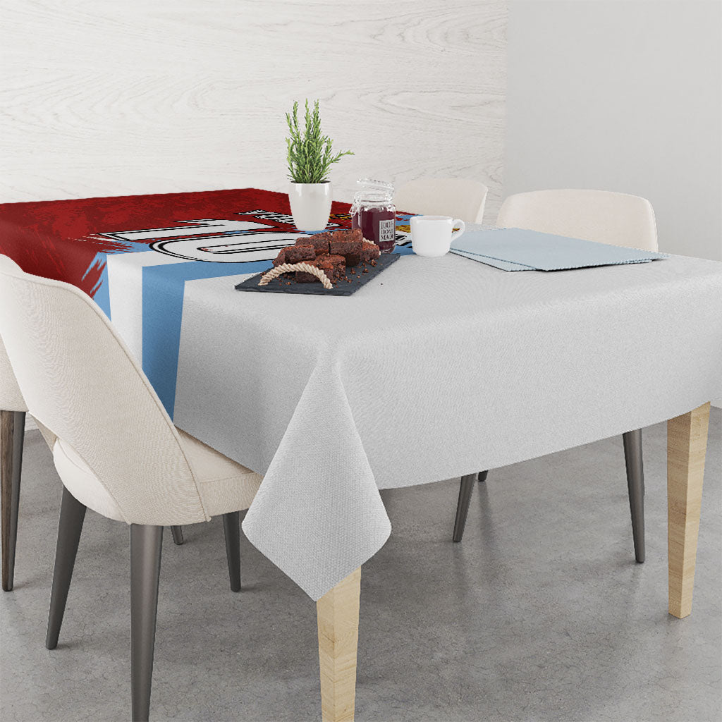 Red and blue grunge football tablecloth with grey right half and draped corner edge