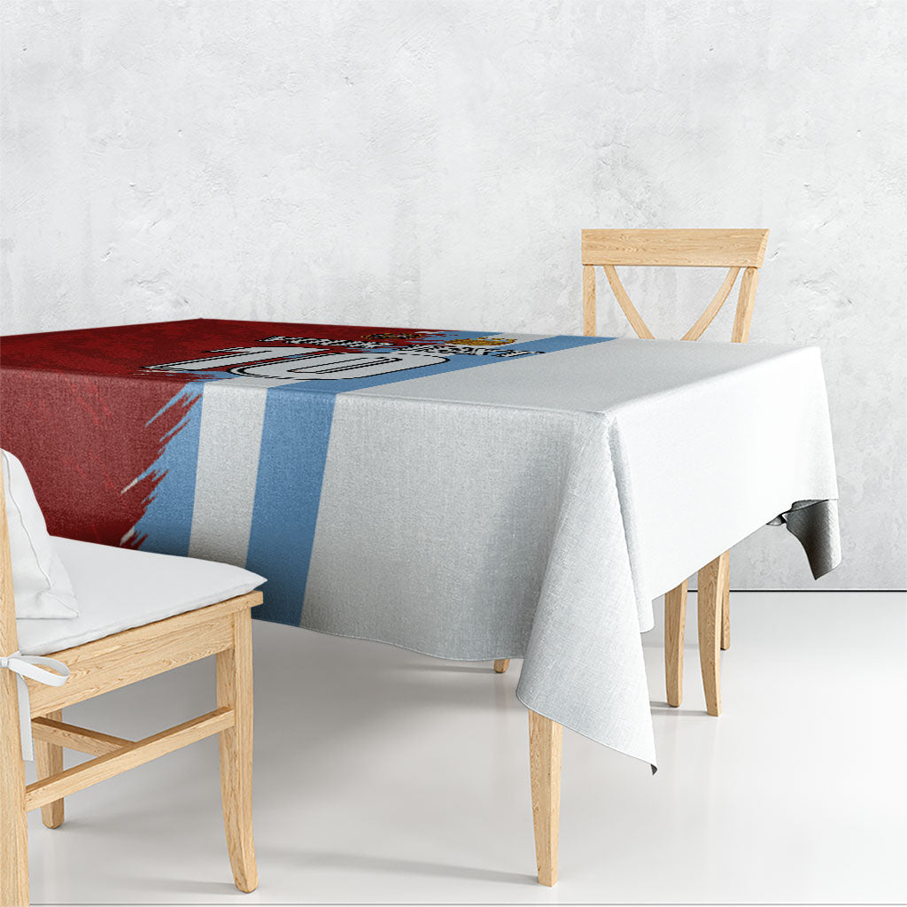 Half red and blue grunge football tablecloth with grey right half and white draped edge