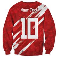 Red crewneck sweatshirt with large '10' back print and white diagonal stripe