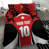 Red and black bedding set with maple leaf motif, 'YOUR TEXT' and number 10.