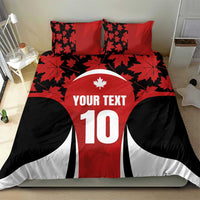 Red and black duvet set with maple leaves on pillow covers, number 10 and 'YOUR TEXT'.