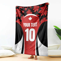 Red and black maple leaf rugby jersey blanket with white number 10 center panel