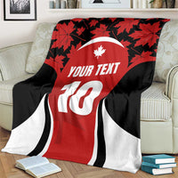 Red rugby jersey throw blanket on armchair, maple leaves, black/white stripes, white 10