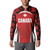 Red button rugby sweatshirt with Canada graphic, black maple leaf sleeves and front panel