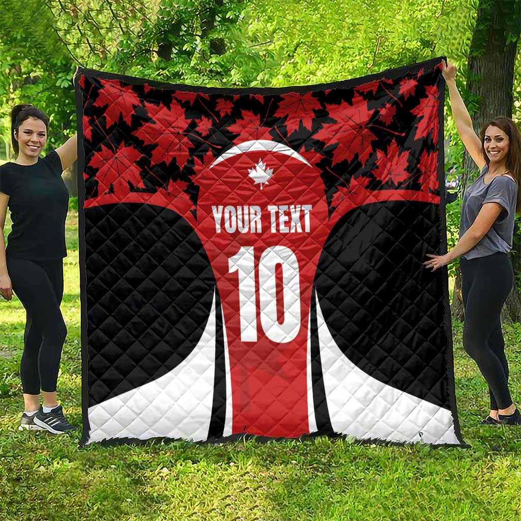 Canada-themed quilt blanket with red maple leaves, black sides, white accents and number 10