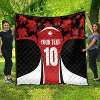 Canada-themed quilt blanket with red maple leaves, black sides, white accents and number 10
