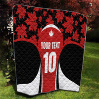 Red, black and white Canada-themed quilt blanket with maple leaves and large number 10