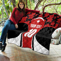 Canada-themed quilt blanket spread on a sofa, red maple leaves with number 10 and custom text