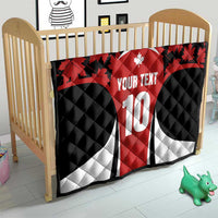 Canada-themed quilt blanket on a crib, red maple leaves with custom text and number 10