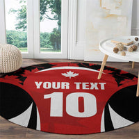 Round red rug with maple leaf and 'YOUR TEXT' over large 10, black-and-white graphics