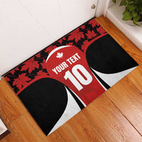 Corner view red maple-leaf rubber doormat with Your Text 10 on white jersey panel
