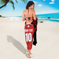 Red, black, and white maple leaf sarong with 'YOUR TEXT' and number 10 front print