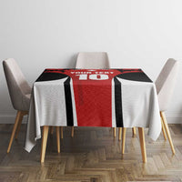 Rectangular red, black and white maple leaf tablecloth centered on dining table