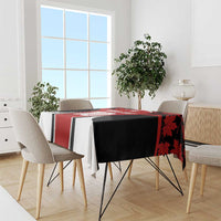 Red maple leaf tablecloth with black and white stripes on dining table