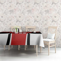 Red and black maple leaf tablecloth with white stripes on dining table