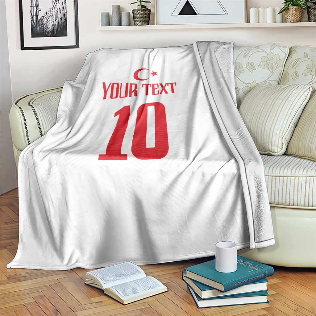 White blanket draped on couch with red Turkish crescent, number 10 and YOUR TEXT