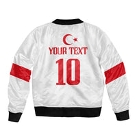 White bomber jacket with red Turkey star and number 10 back graphic, ribbed black trim.