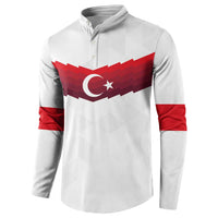 White quarter-zip sweatshirt with red Turkey flag emblem and red striped sleeves