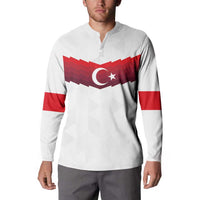 White long-sleeve quarter-zip sweatshirt with red flag chest graphic and red sleeve stripes