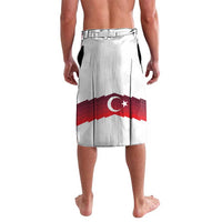 White lavalava beach skirt with red Turkey flag emblem and wide red stripe panel