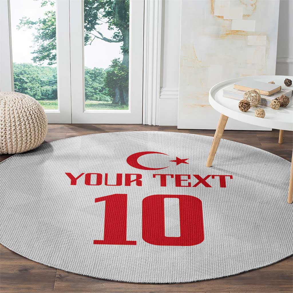 Light gray round carpet with red crescent, 'YOUR TEXT', and number 10 on floor