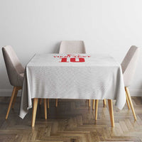 White square tablecloth with red crescent-star “10” emblem at center