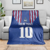 Blue football-themed blanket with red-white stripe panel, crest and large number 10