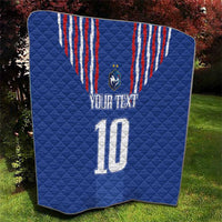 Blue quilt blanket with red-and-white crest stripes, shield emblem, “YOUR TEXT” and number 10