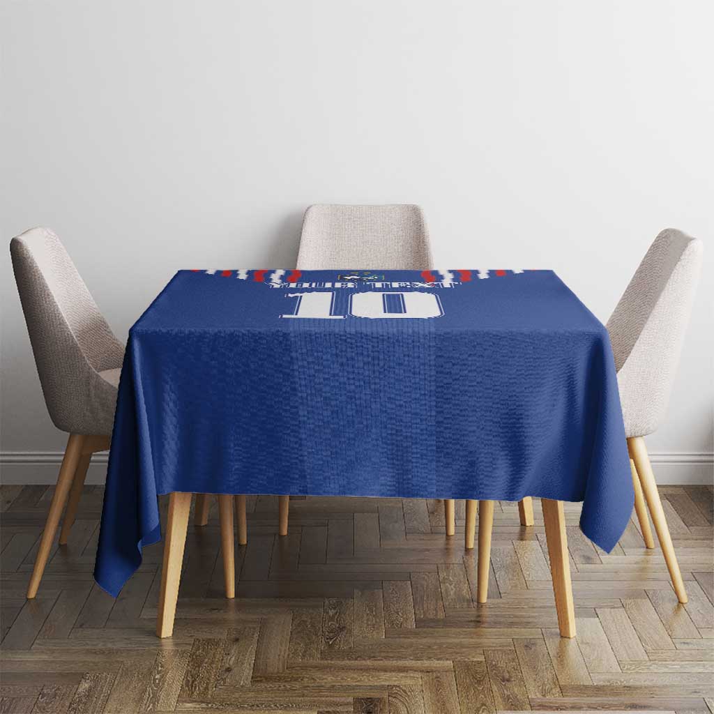 Blue tablecloth with number 10 print on small dining table with four chairs