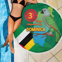 Round green beach blanket with Dominica flag, map, parrot graphic and white tassel edge