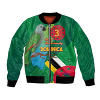 Green bomber jacket, front zipper; black ribbed trim; parrot and Dominica flag/map graphics