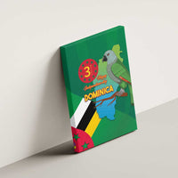 Green canvas wall art on wall featuring parrot and Dominica flag/map, angled