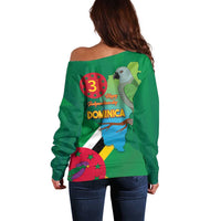 Green off-shoulder sweater back view with Dominica map/flag graphic and '3' badge