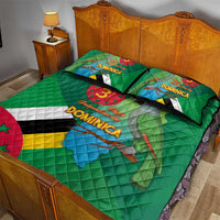 Green quilt bed set with Dominica text, flag bands, and parrot on map print; two pillows