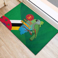 Green rubber doormat corner view with Dominica flag, map, and parrot